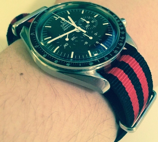 Omega Speedmaster on a black and red striped NATO strap from #cheapestnatostraps.com #omegaspeedmaster #omega #speedmaster #speedy #natostrap #natoband #klocksnack #watchuseek #watchband #watchstrap